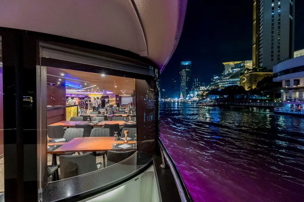  Bangkok skyline illuminated as seen from Chao Phraya dinner cruise