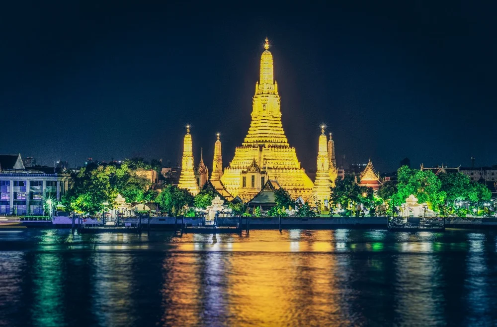 Chao Phraya dinner cruise passing Wat Arun Temple at night